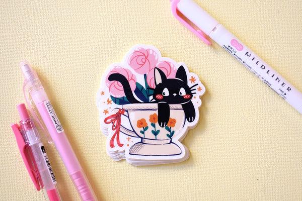 Kitty in a Cup Sticker by The Moonborn